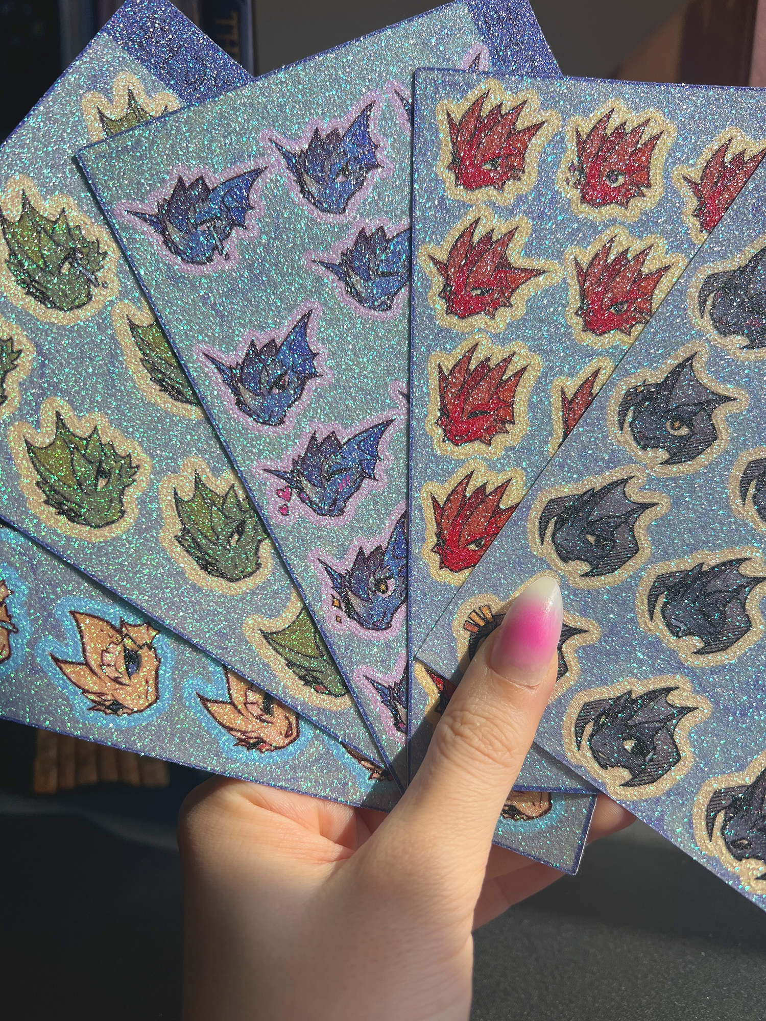 five glitter mood sticker sheets of kobolds with different emotions